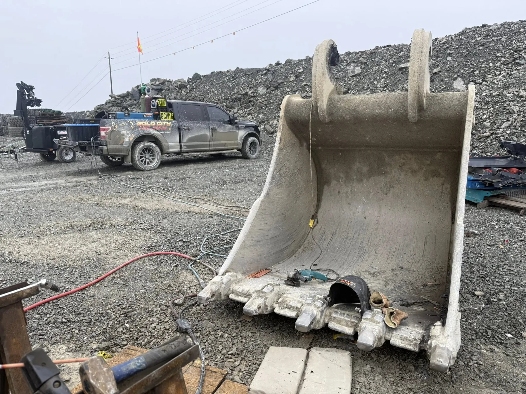 Bucket repair work in a yard